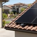 Rooftop solar panels on a tile roof